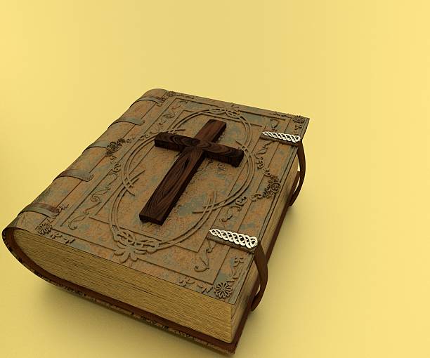 istock Old Leather-Bound Bible and Cross 627399740