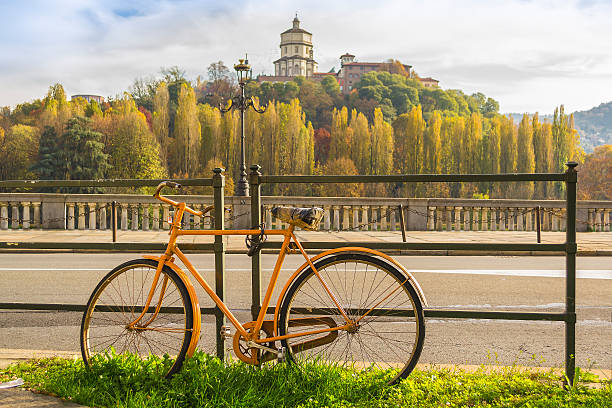 Yellow bicycle along the river in Turin (Piedmont, Italy)