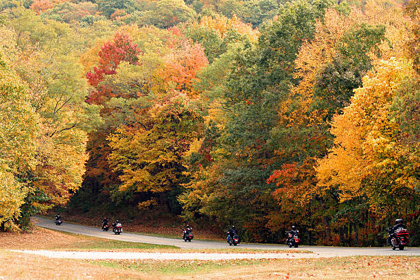 Cherokee, North Carolina, USA - October 17, 2016 - 7 motorcyclists near Big Witch Overlook on the Blue Ridge Parkway, heading toward Cherokee, North Carolina
