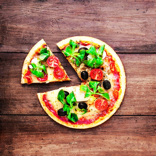 istock Hot pizza slice with cheese on  rustic wooden table  ready 627415894