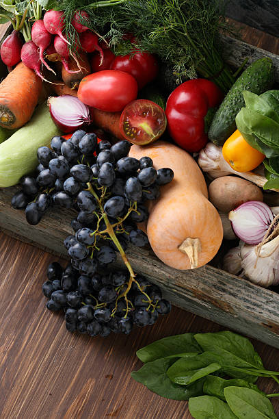 istock Farmer vegetables on wood 627416118