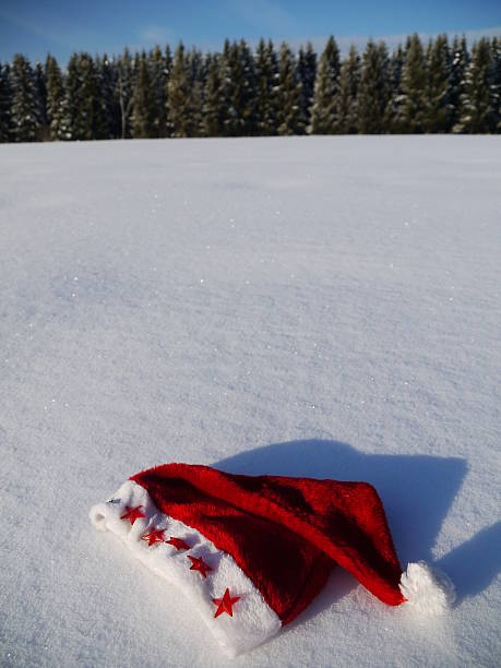 istock santa hat in the snow 627416142