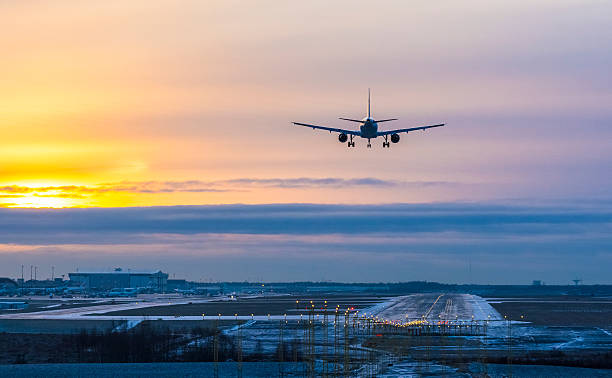 istock Airplane landing to airport runway 627416786