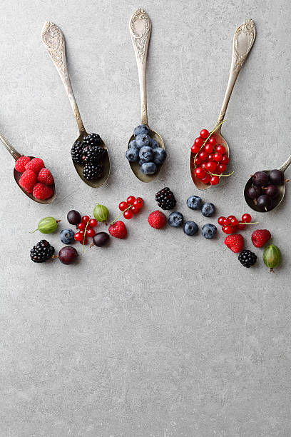 istock Food background with berries and spoons 627417316