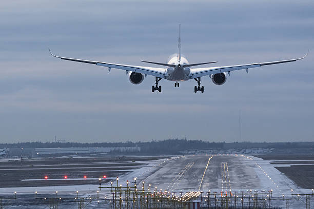 istock Airplane landing to airport runway 627418762