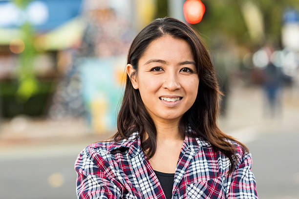 Smiling asian woman looking at the camera