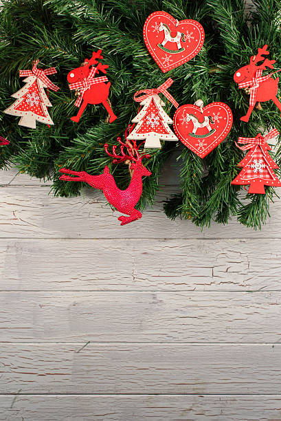 istock Holiday decorations. Christmas tree with red hurts and funny deers 627430428