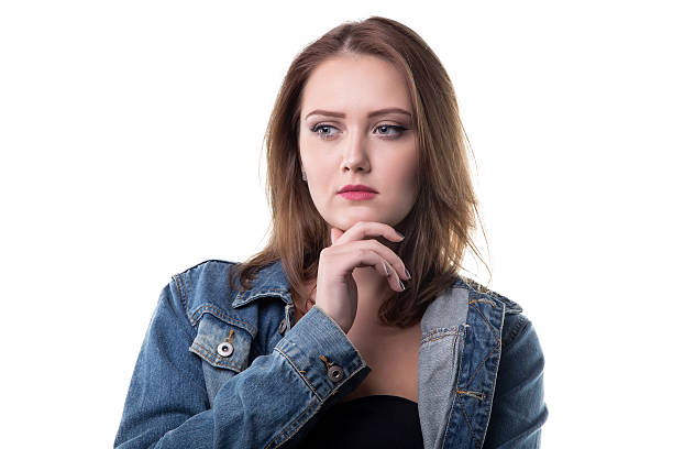 istock Puzzled woman in jeans jacket 627430684