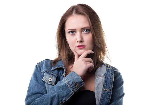 istock Thinking woman in jeans jacket 627430706