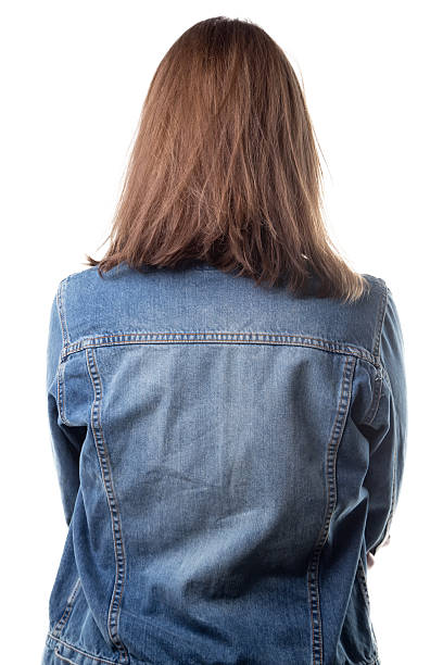 istock Woman in jeans jacket from back 627431110
