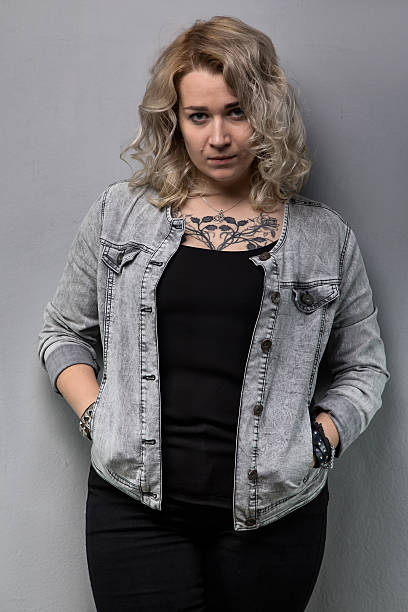 istock Blond woman with hands in the pockets 627431766