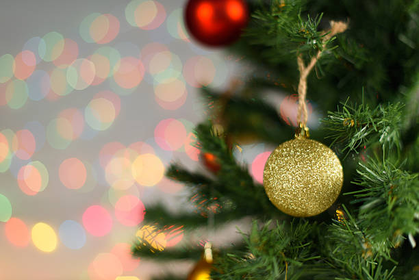 istock Christmas tree with decorative golden and red balls on it 627431934