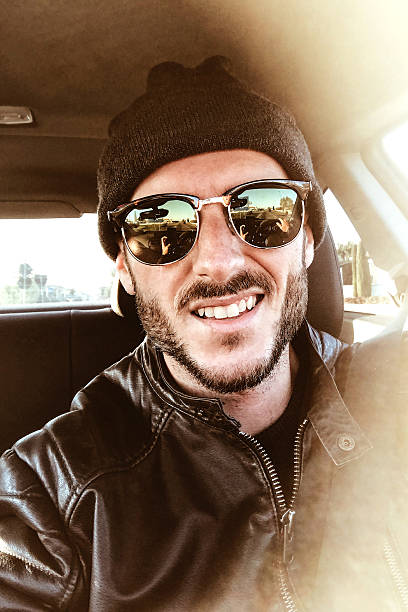 istock fashion man inside the car 627442124