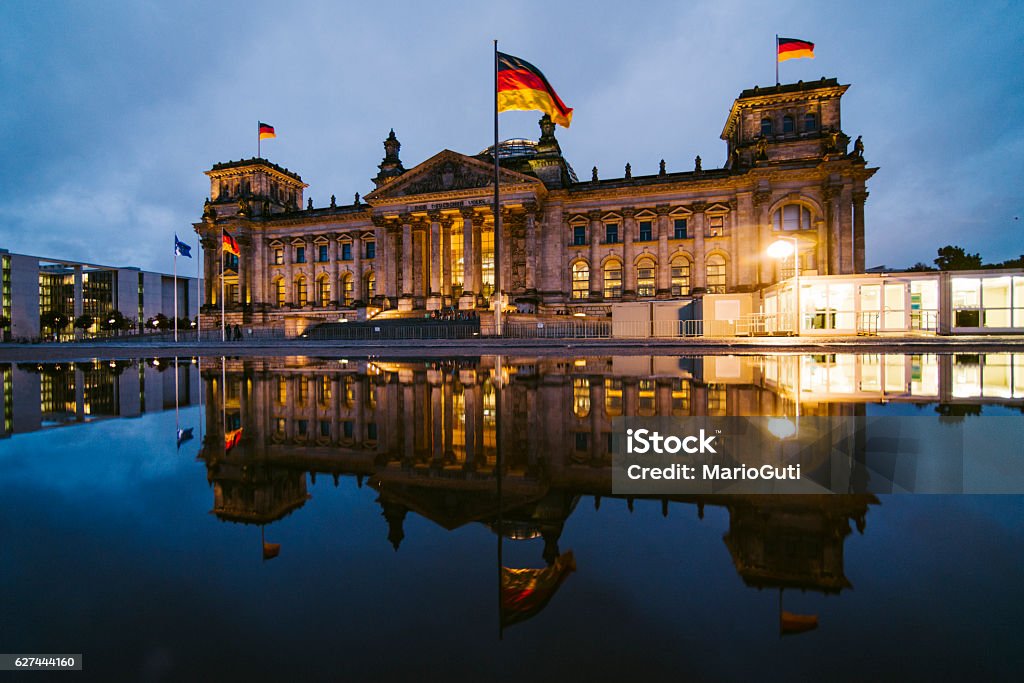 Reichstag, Berlin The Reichstag building in Berlin, Germany, and its reflection at night The Reichstag Stock Photo