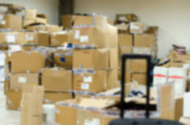 istock pile of boxes in a warehouse ,soft focus 627444914