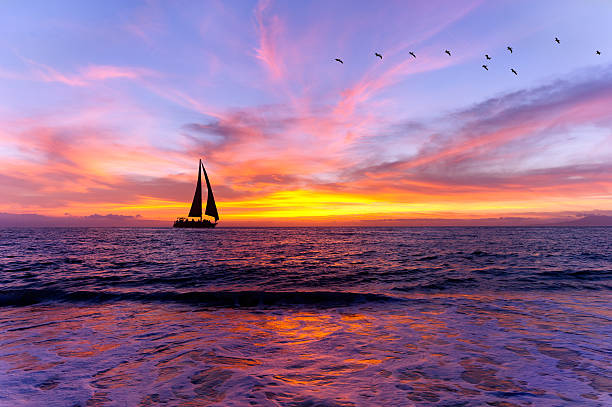 istock Ocean Sunset Sailboat Silhouette 627447132