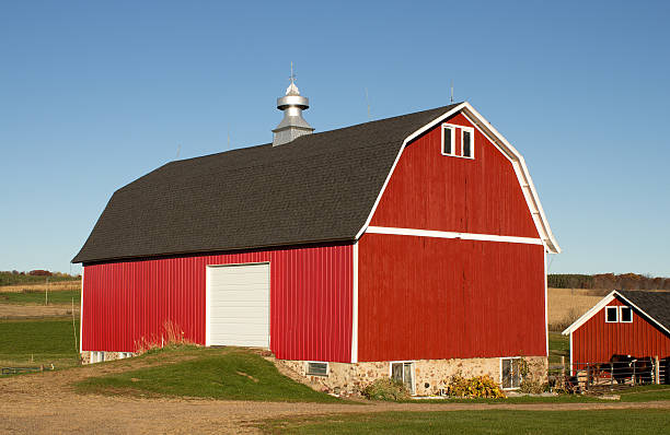 istock Red barn and horse shed 627447322