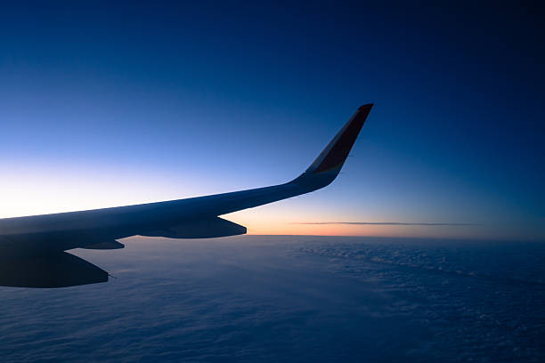 Clouds and sky as seen through window of an aircraft