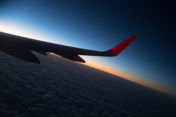 Clouds and sky as seen through window of an aircraft