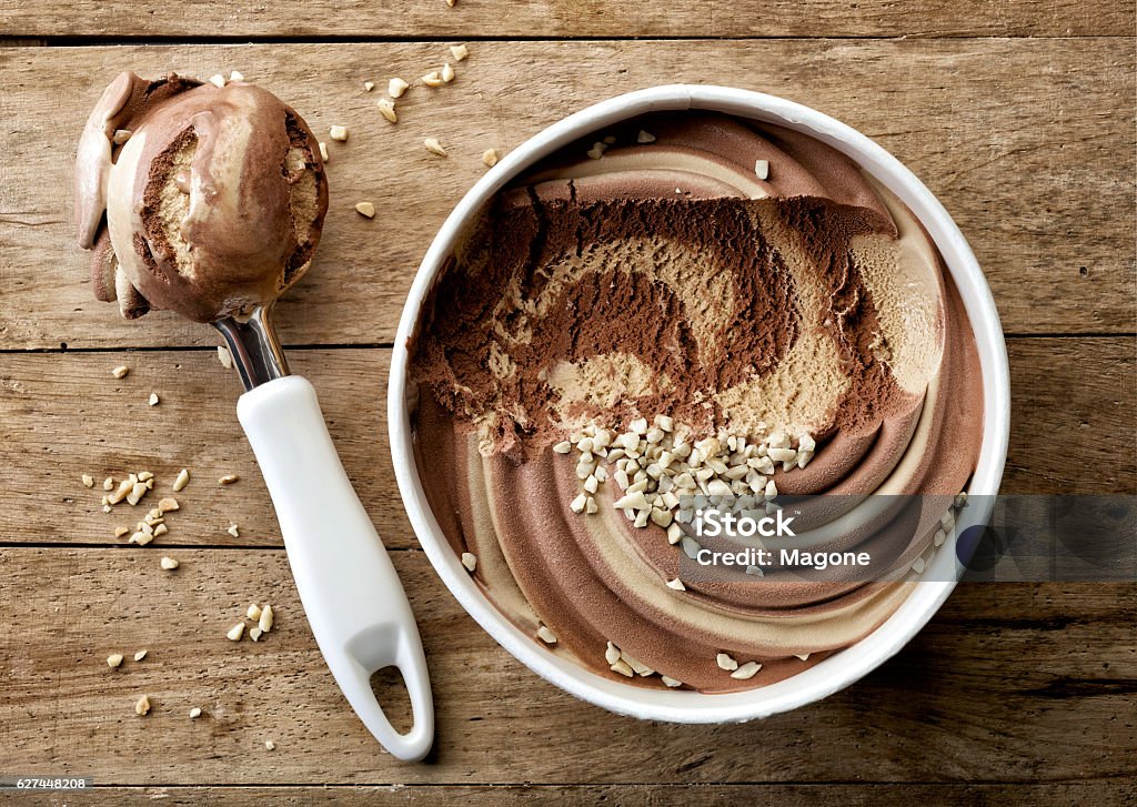 chocolate and peanut ice cream chocolate and peanut ice cream on wooden table, top view Ice Cream Stock Photo