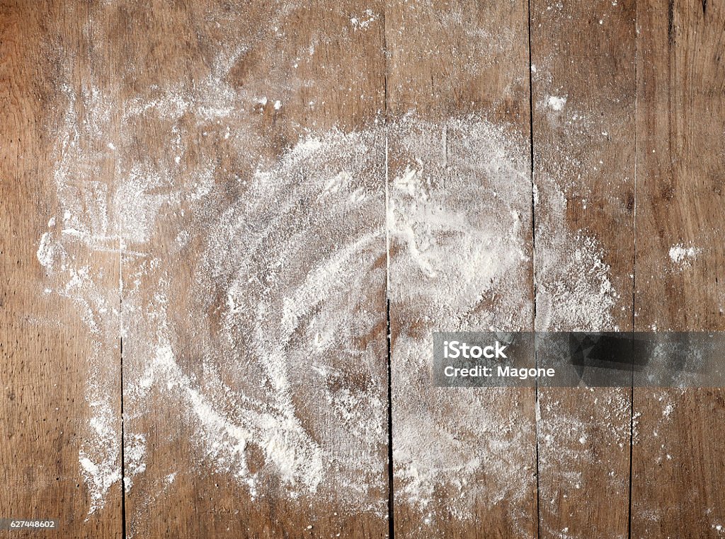 white flour on wooden table white flour on rustic wooden table, top view Flour Stock Photo