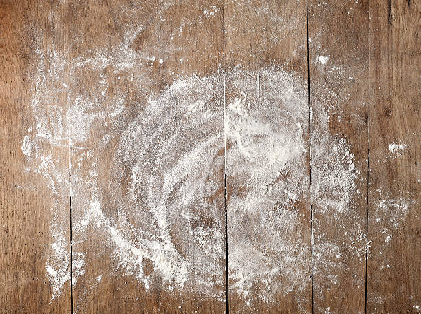 white flour on wooden table white flour on rustic wooden table, top view flour stock pictures, royalty-free photos & images