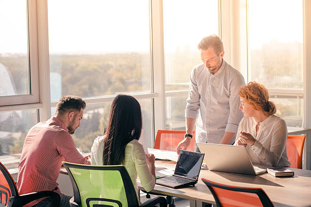 istock Business people working in board room in office 627453724