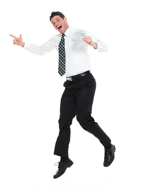 istock Cheerful businessman jumping with money 627454494