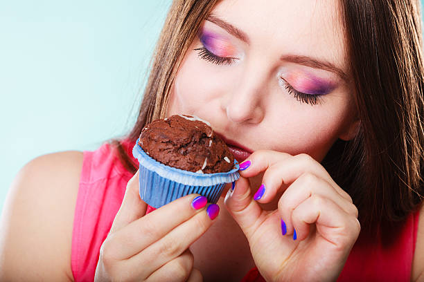 istock Smiling woman holds chocolate cake in hand 627456668