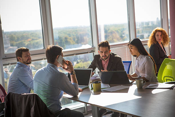 istock Business people working in board room in office 627457604