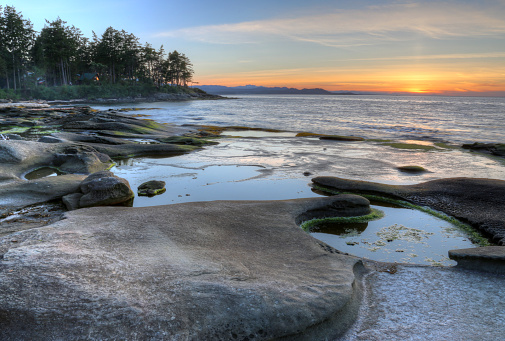 A sunset on the shoreline of Gabriola Island, in British Columbia, Canada.