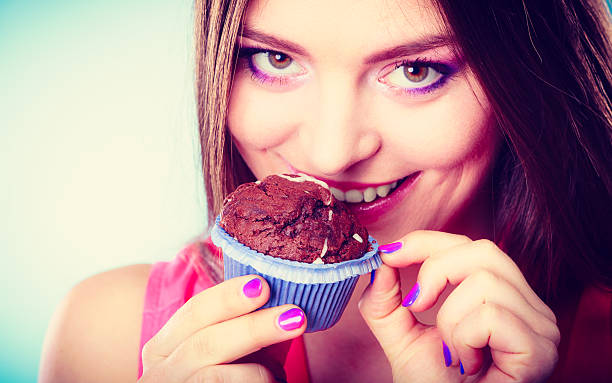 istock Smiling woman holds chocolate cake in hand 627459766