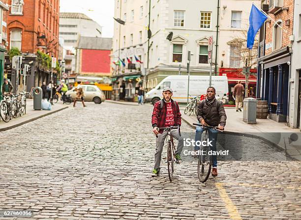 Mixed Race Gay Couple With Bicycles In The City Stock Photo - Download Image Now - Dublin - Republic of Ireland, People, Bicycle