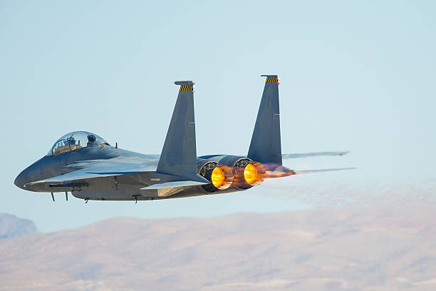 istock F-15 Eagle against the Nevada hills, with afterburner on 627461026