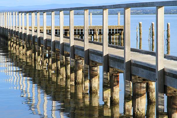 istock Long wooden boat jetty 627461146