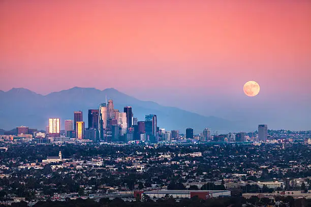 Superman moonrise over the downtown Los Angeles skyline and the San Gabriel Mountains, as seen from the Baldwin Hills Scenic Overlook, November 13th, 2016.
