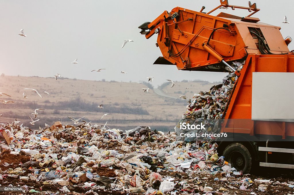Garbage truck dumping the garbage Garbage truck dumping the garbage on a landfill  Landfill Stock Photo