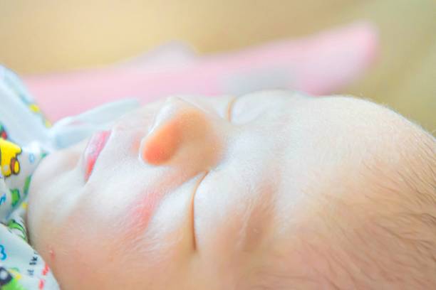 istock soft focus of Newborn baby sleeping 627472364
