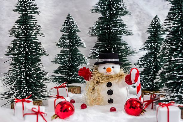 istock Snowman in the pine forest with snow for christmas 627473180