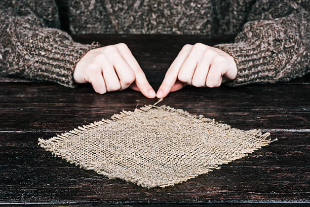 Hands behind sackcloth