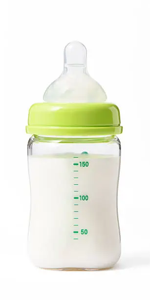 Baby bottle with powdered milk isolated on white background with clipping path.