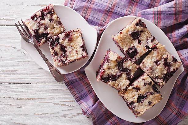 istock Sponge cake with blueberries close-up on a plate. horizontal 627477230