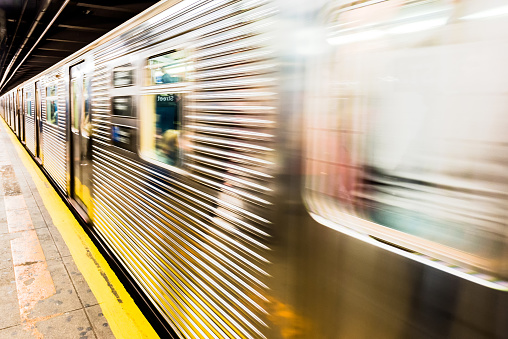 New York City subway train leaving its station - motion image