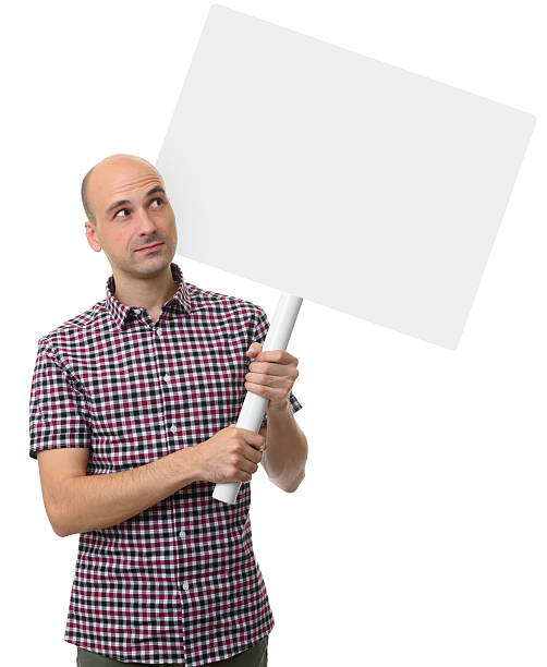 istock demonstration concept. Man holding a blank poster 627477410