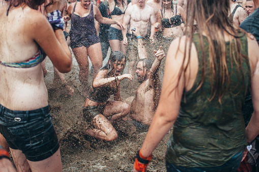 Kostrzyn nad Odra, Poland - August 1, 2013: Young people bathe in the mud on the 19 woodstock festival 