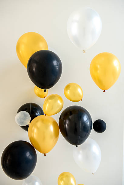 istock yellow white and black balloons 627491864