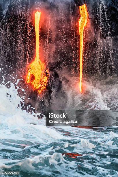 Molten Lava Flowing Into The Pacific Ocean On Big Island Stock Photo - Download Image Now