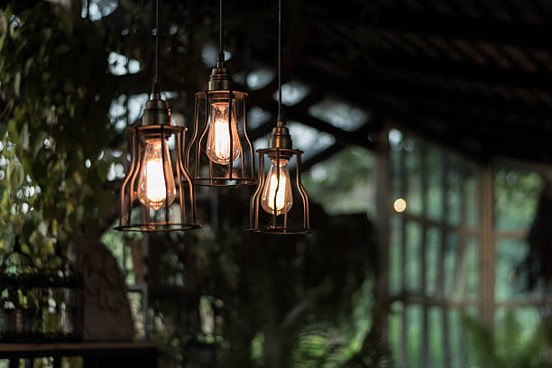 istock beautiful Light bulb incandescent hanging decorated interior roo 627499290