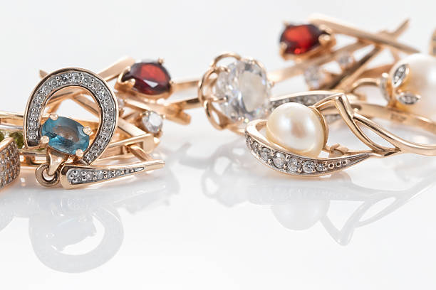 istock Gold rings, earrings with Topaz and pearls 627500538