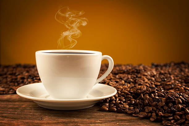 istock Porcelain cup of coffee on brown background 627509932
